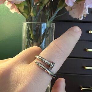 Silver colored (brass) nail ring size 9. Inspired.